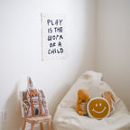 play is the work of a child banner